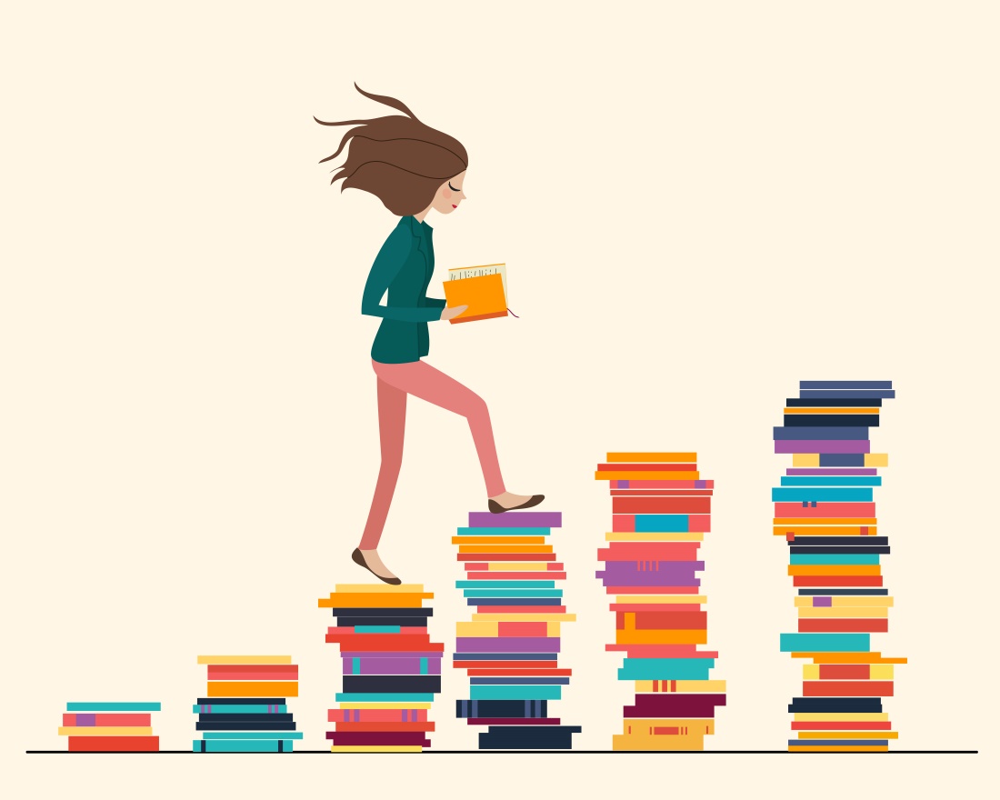 Girl walking up stack of books
