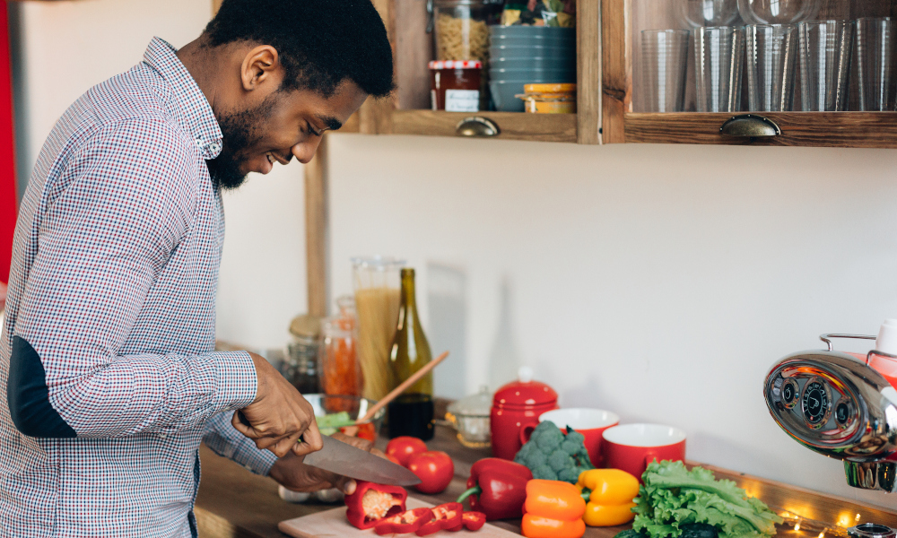 Man chopping vegetables